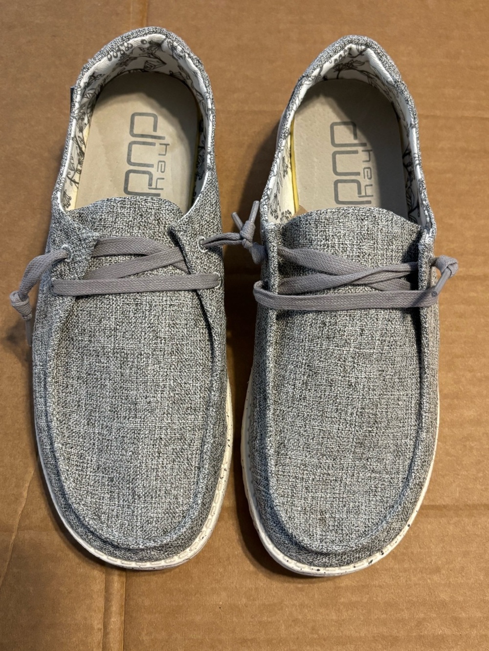 Hey Dude Women's Wendy Linen Slip-On Shoes in "Iron" grey colorway.